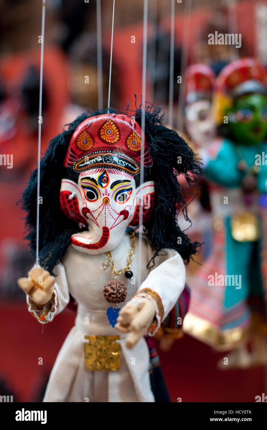Colourful puppets hanging on display in the historical Newar city of Bhaktapur, Nepal Stock Photo