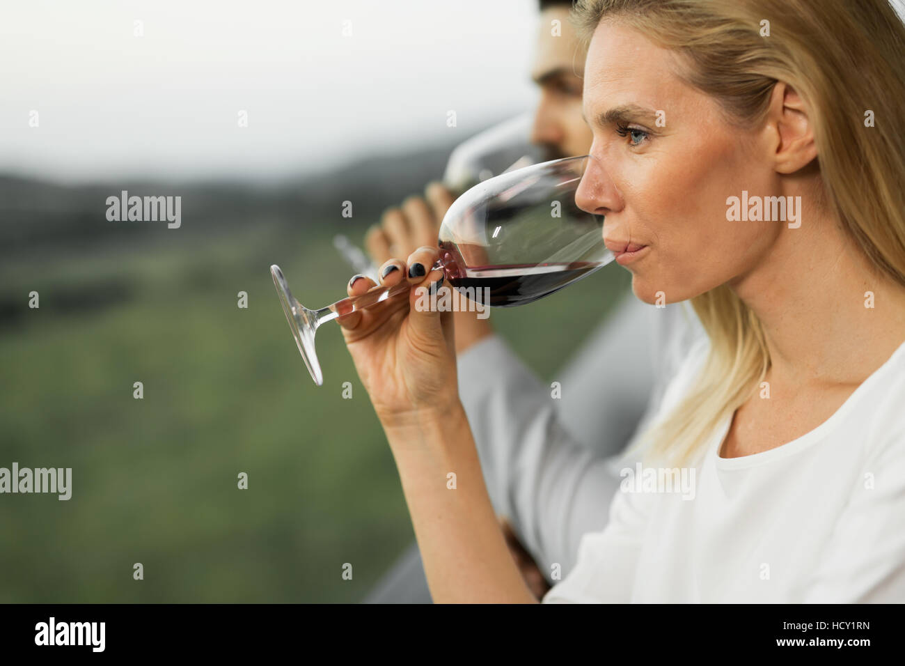 People tasting wine outdoors at wine tasting event Stock Photo