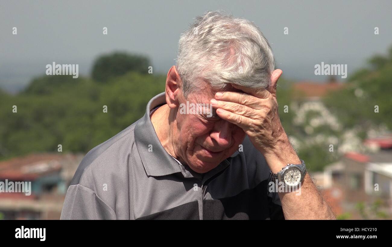 Sad And Tearful Old Man Or Senior Stock Photo