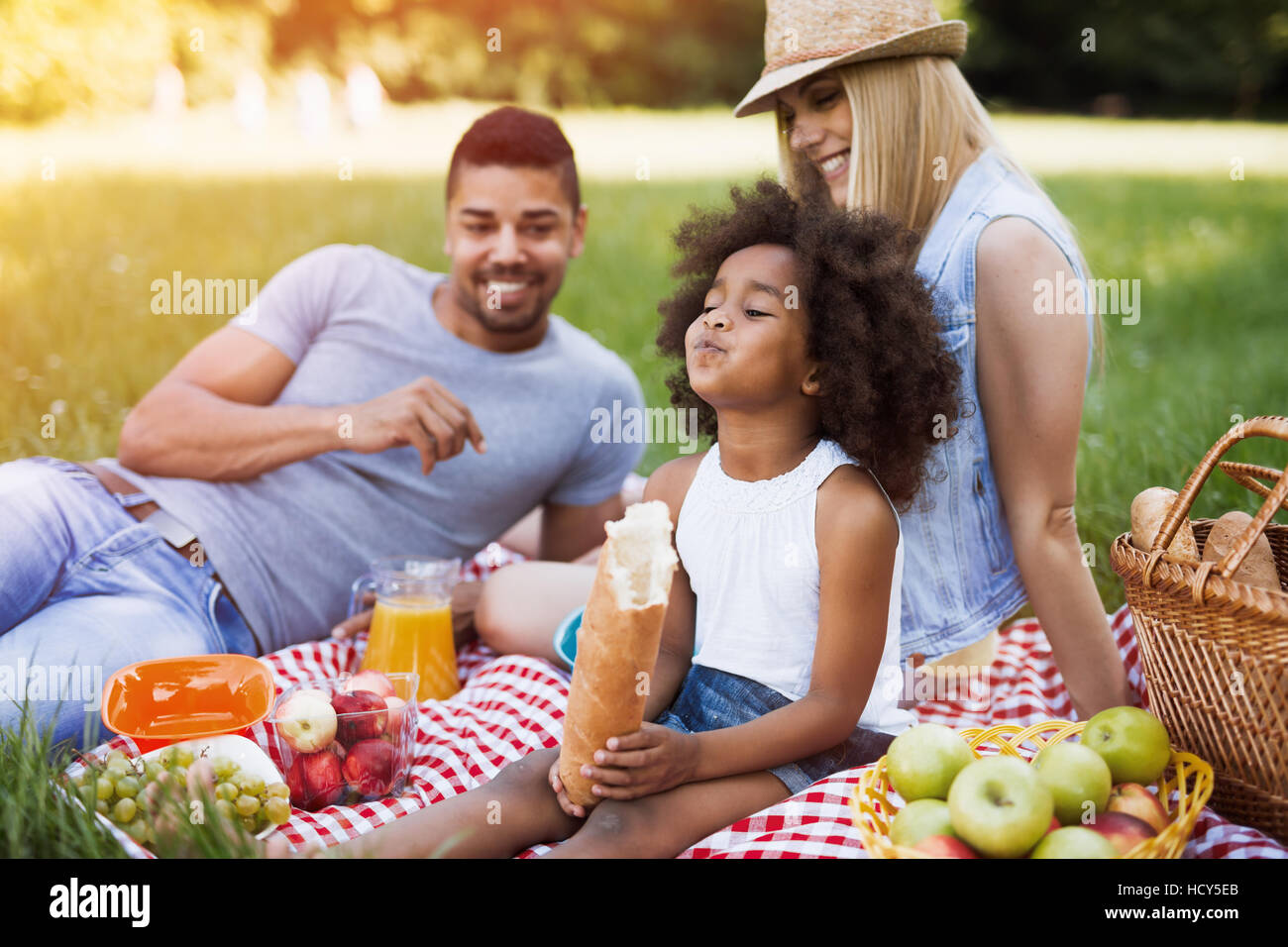 Happy family enjoying picnic in nature Stock Photo - Alamy