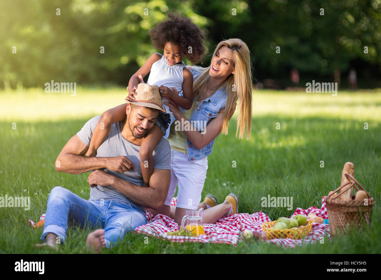 Happy family enjoying picnic in nature Stock Photo - Alamy