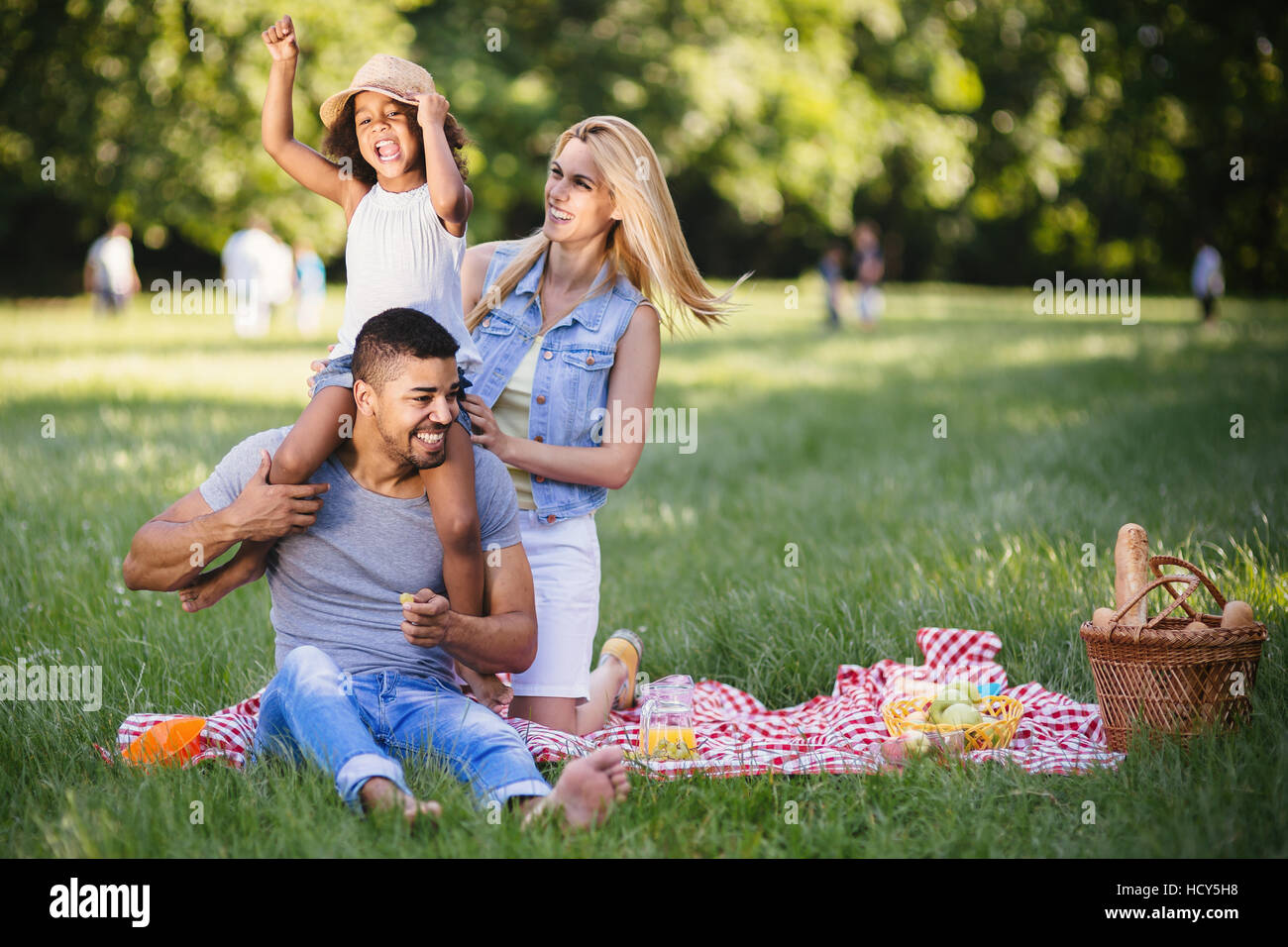 Happy family enjoying picnic in nature Stock Photo - Alamy