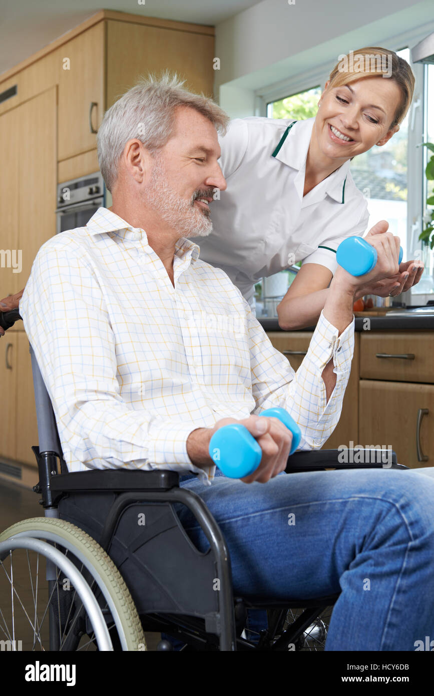 Helping person in wheelchair hi-res stock photography and images - Alamy