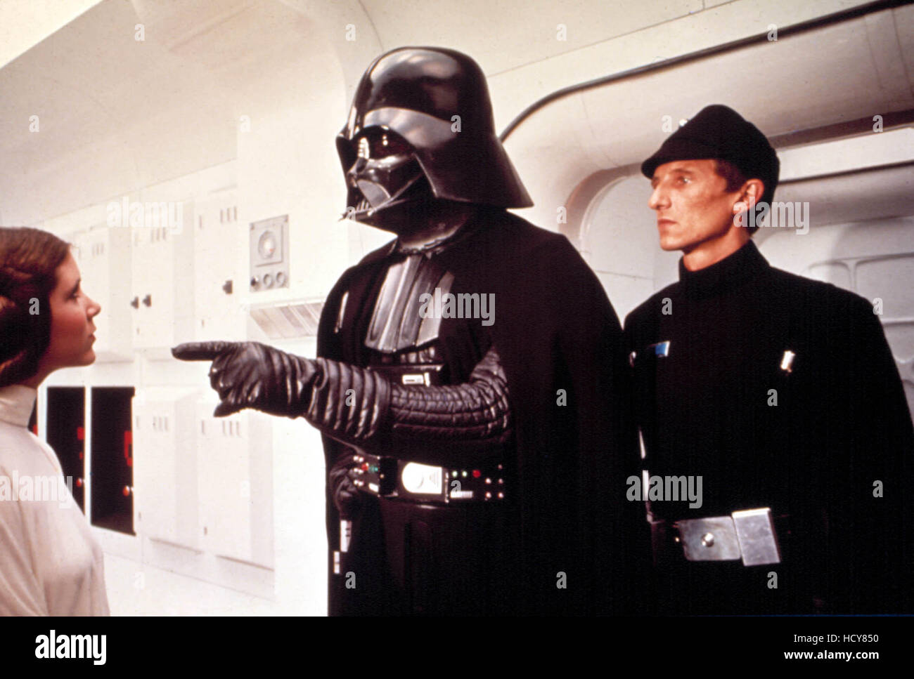 STAR WARS, (aka STAR WARS: EPISODE IV - A NEW HOPE), Carrie Fisher, Darth Vader, 1977 Stock Photo