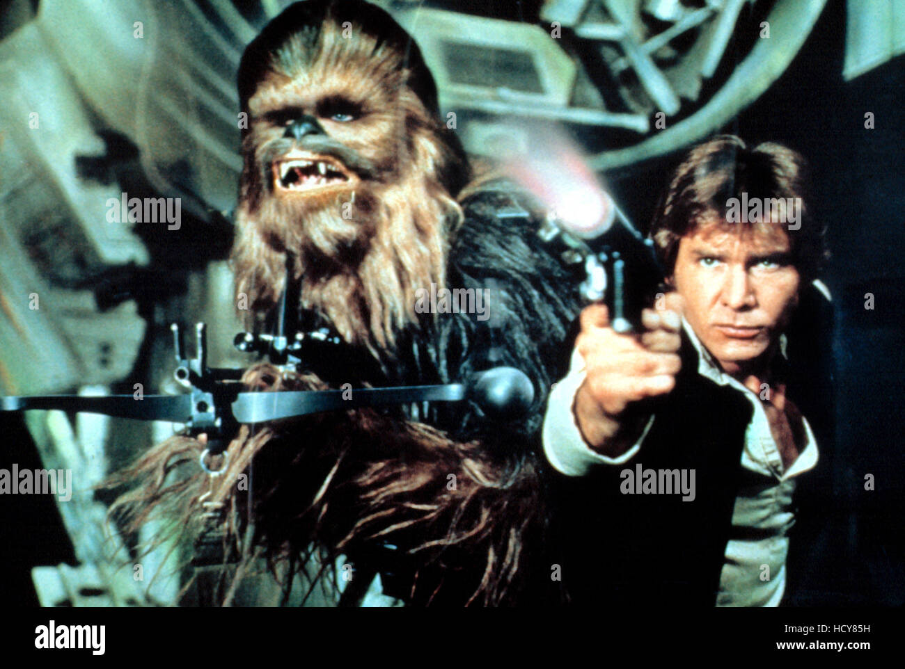 STAR WARS, (aka STAR WARS: EPISODE IV - A NEW HOPE), Chewbacca, Harrison Ford, 1977 Stock Photo
