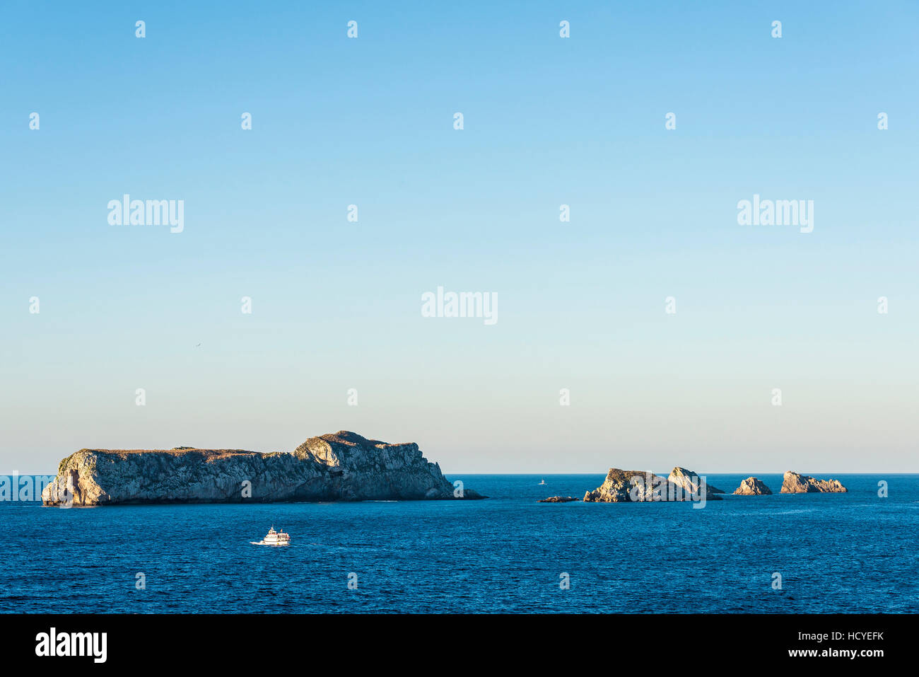 Island with rocky coast of the Atlantic Ocean in Suances, Cantabria, Spain Stock Photo