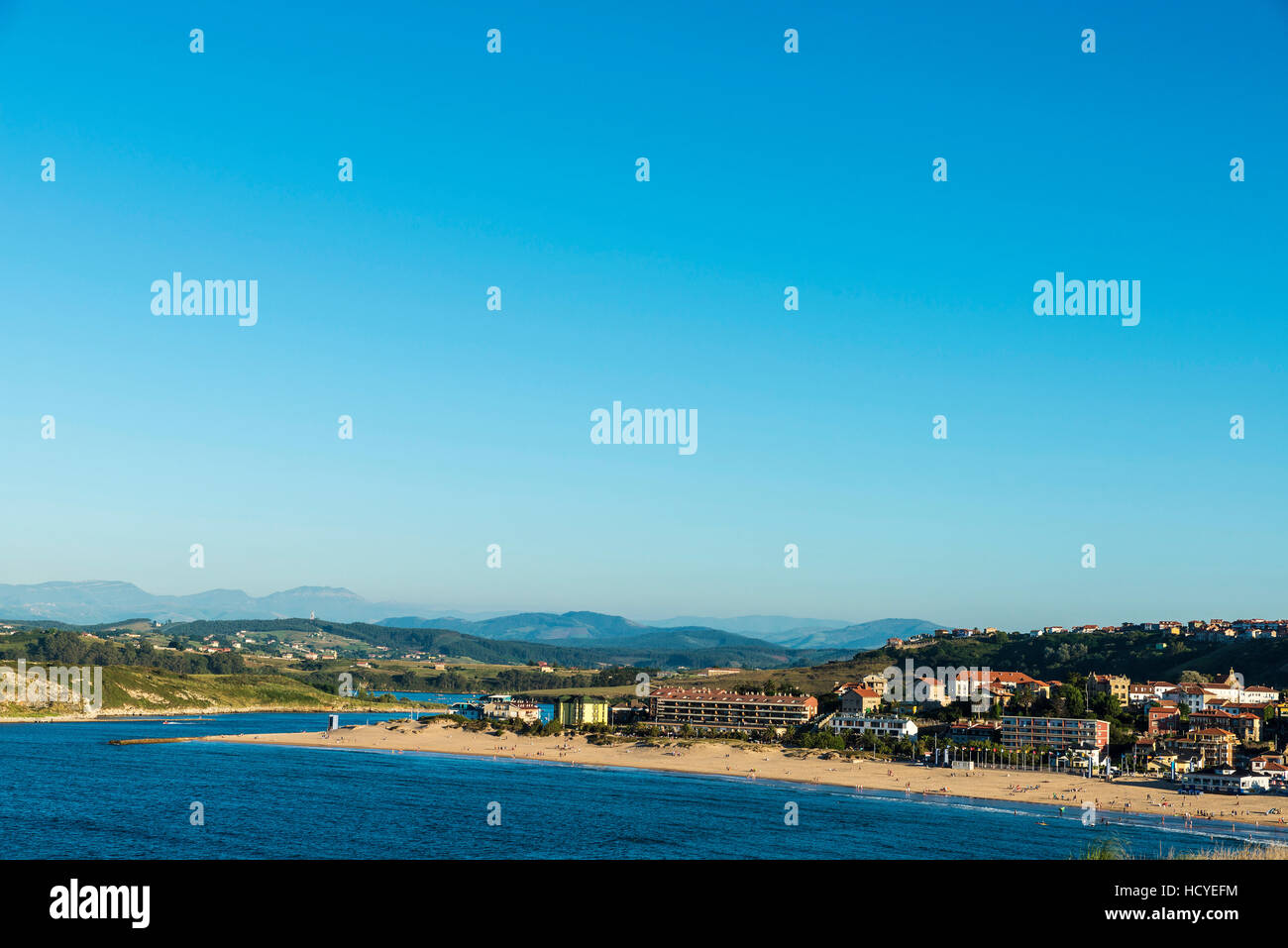Suances beach with people bathing in the Atlantic Ocean in Cantabria, Spain Stock Photo
