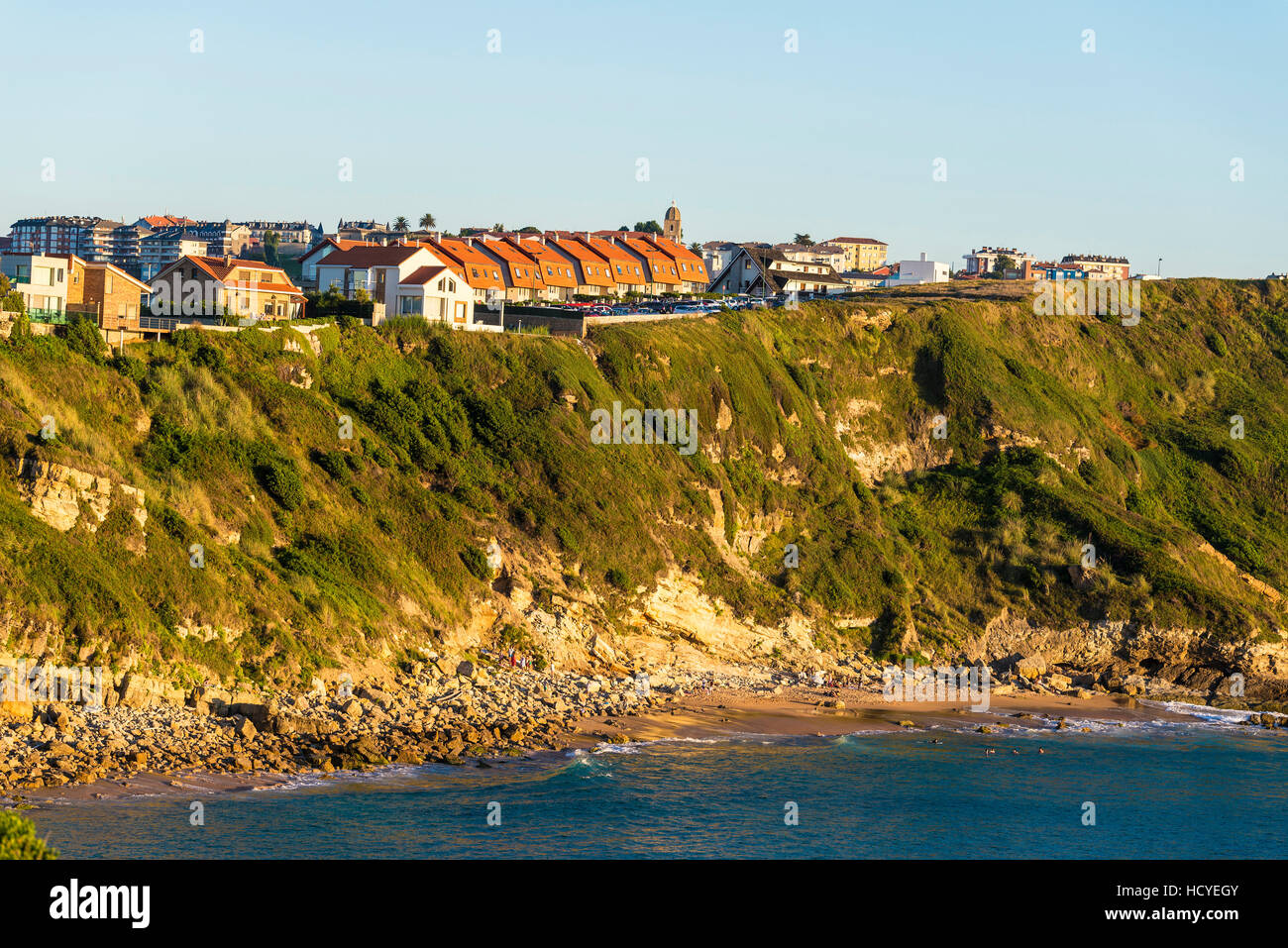Los Locos beach with people bathing in the Atlantic Ocean in Cantabria, Spain Stock Photo