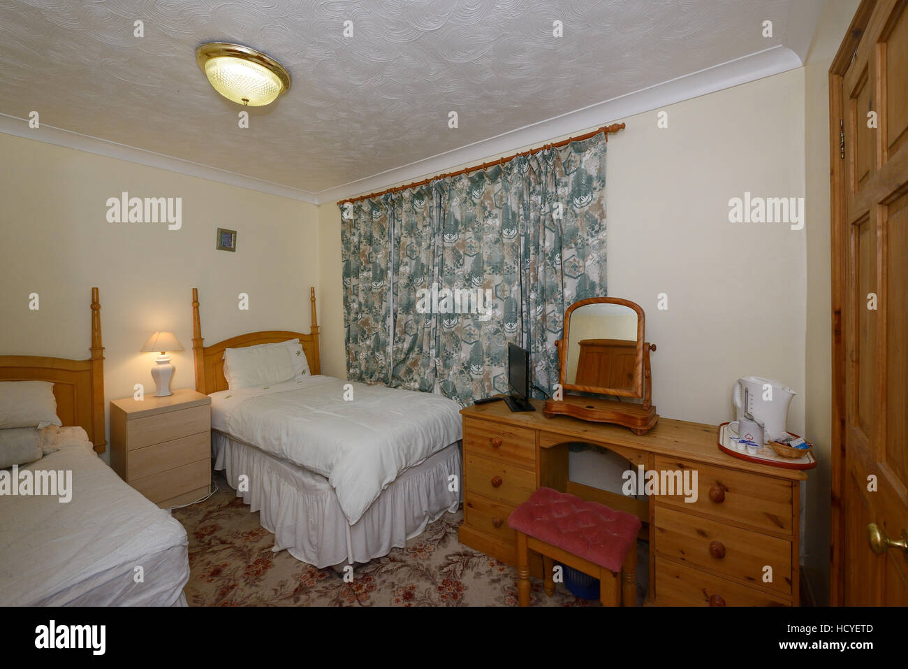 A budget bed and breakfast bedroom in the UK Stock Photo
