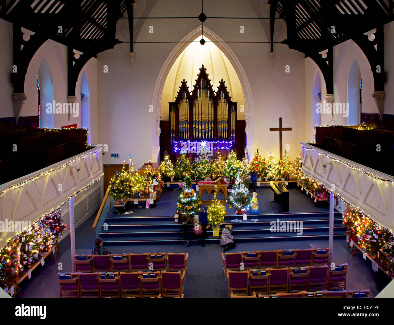 Christmas tree festival in Bridport United Church, Dorset, England UK Stock Photo