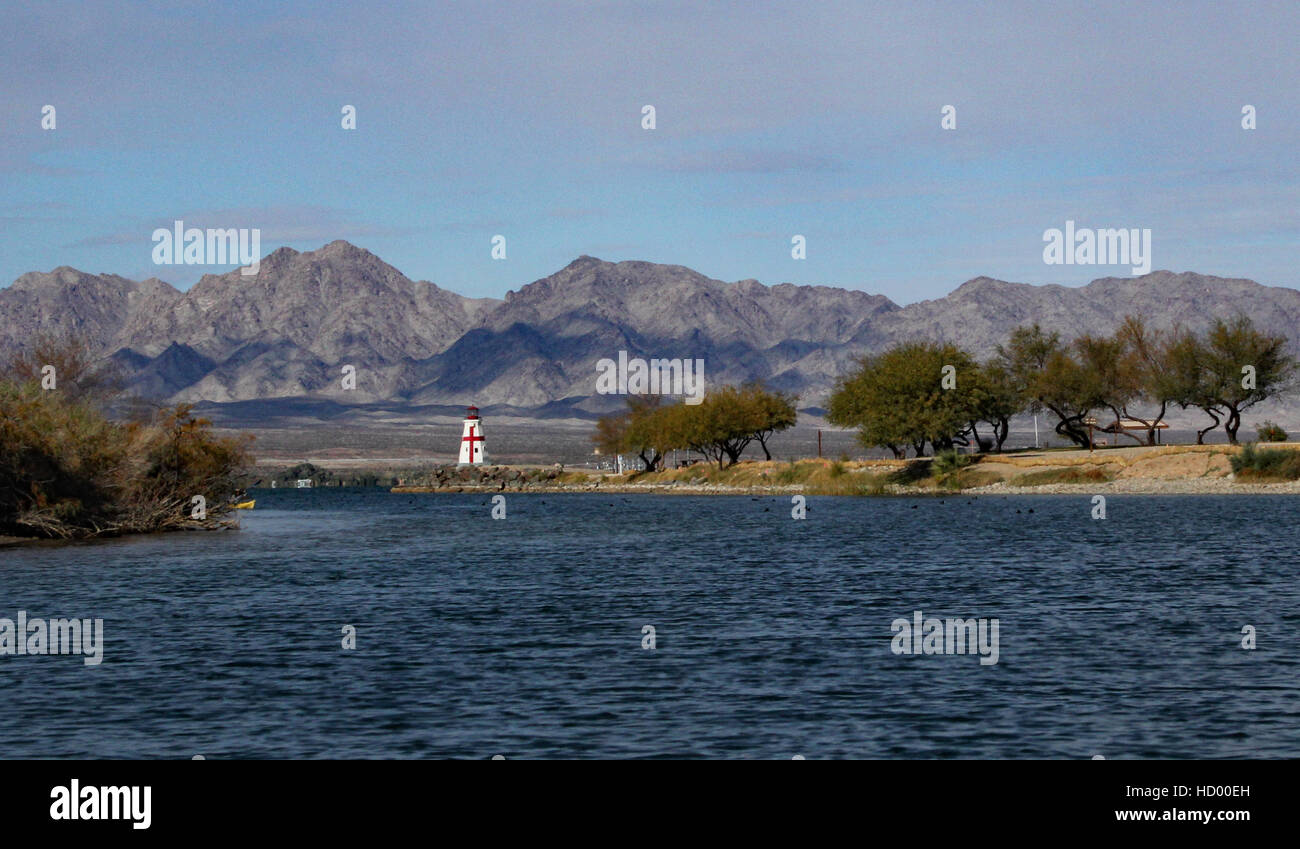 Replica of East Quoddy Lighthouse North end of Bridgewater Channel, in Lake Havasu State Park with mountains and beach Stock Photo