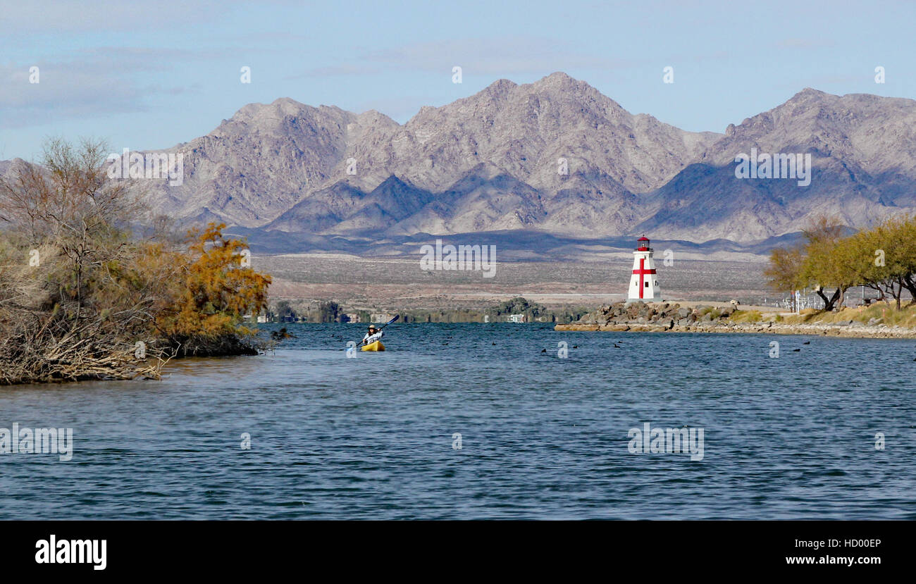 Replica of East Quoddy Lighthouse North end of Bridgewater Channel, in Lake Havasu State Park with mountains and kayaker Stock Photo