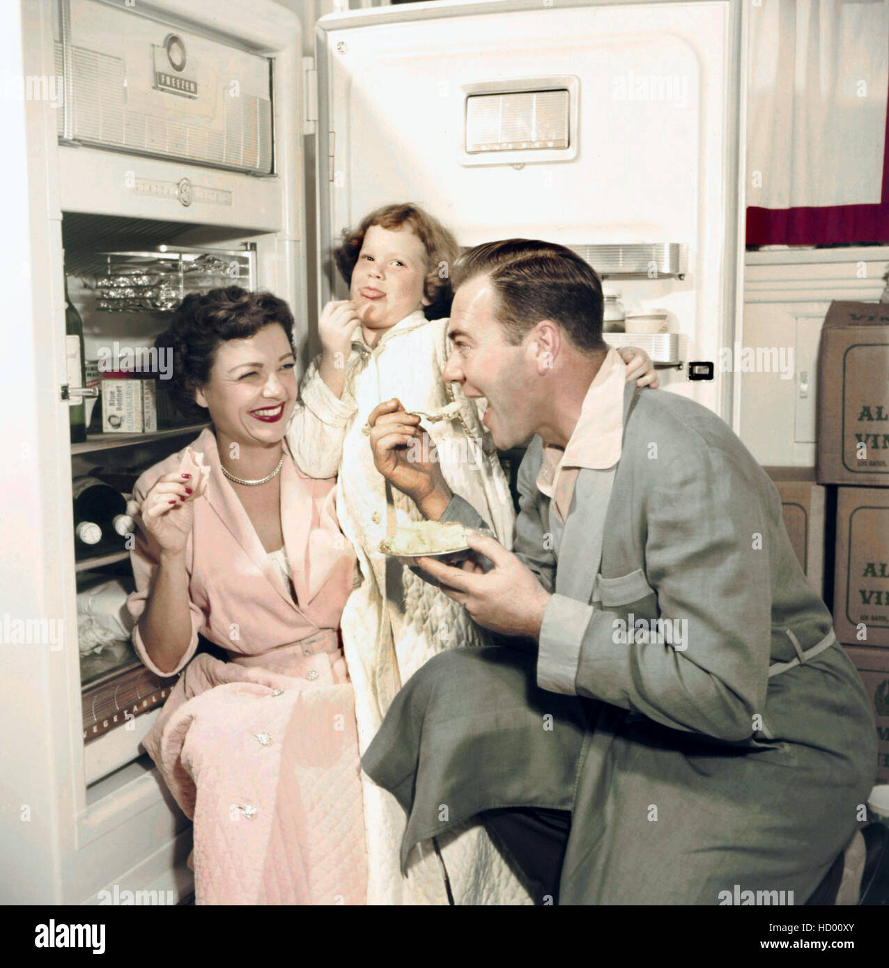 From left Marjorie Reynolds, Linda Reynolds, Jack Reynolds at home, ca