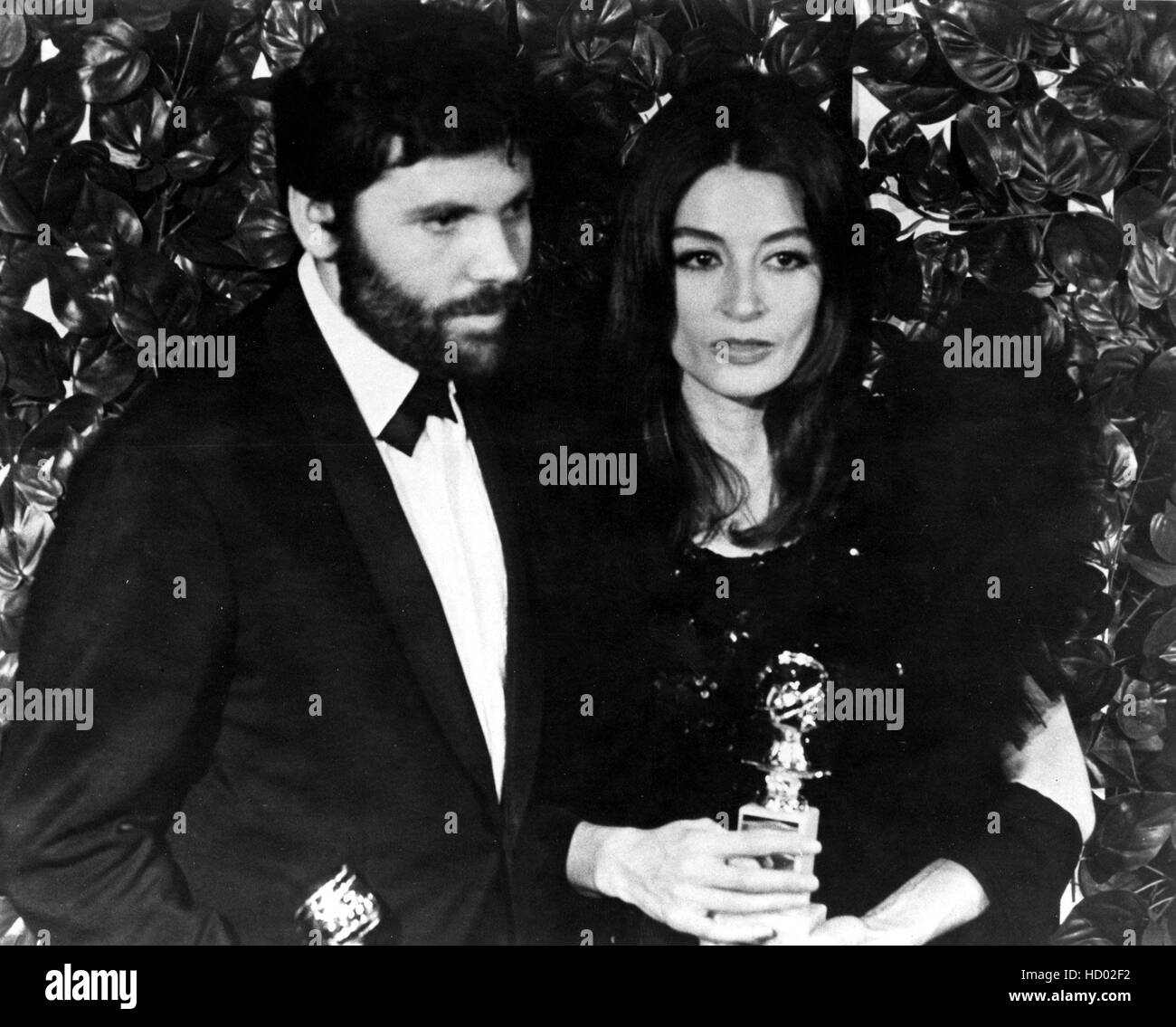 Anouk Aimee, with husband Pierre Barouh, holding her Golden Globe Award ...