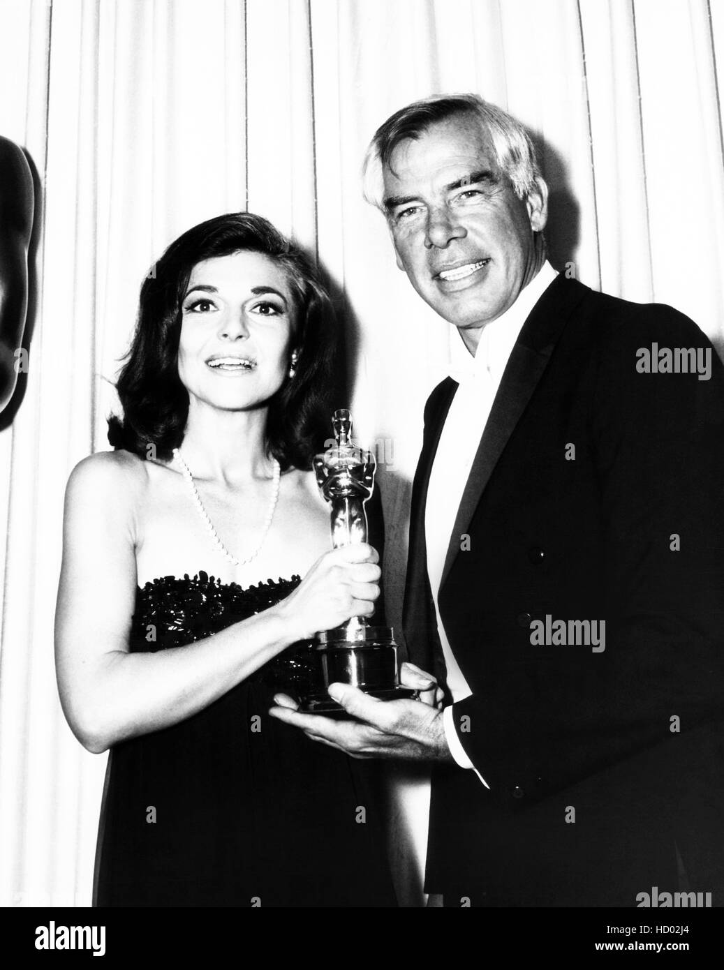 From left: Anne Bancroft accepting the Oscar for an absent Elizabeth ...