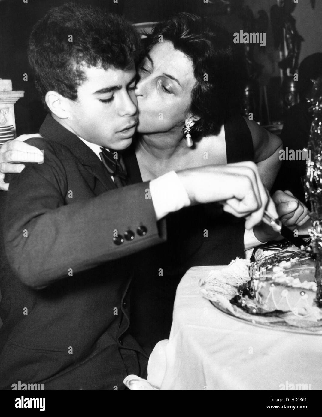 Anna Magnani kisses son, Luca, at his 14th birthday party, 1956 Stock Photo Alamy