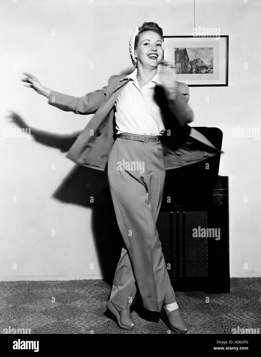 Betty Grable, dancing around to her radio, ca. 1939 Stock Photo Alamy