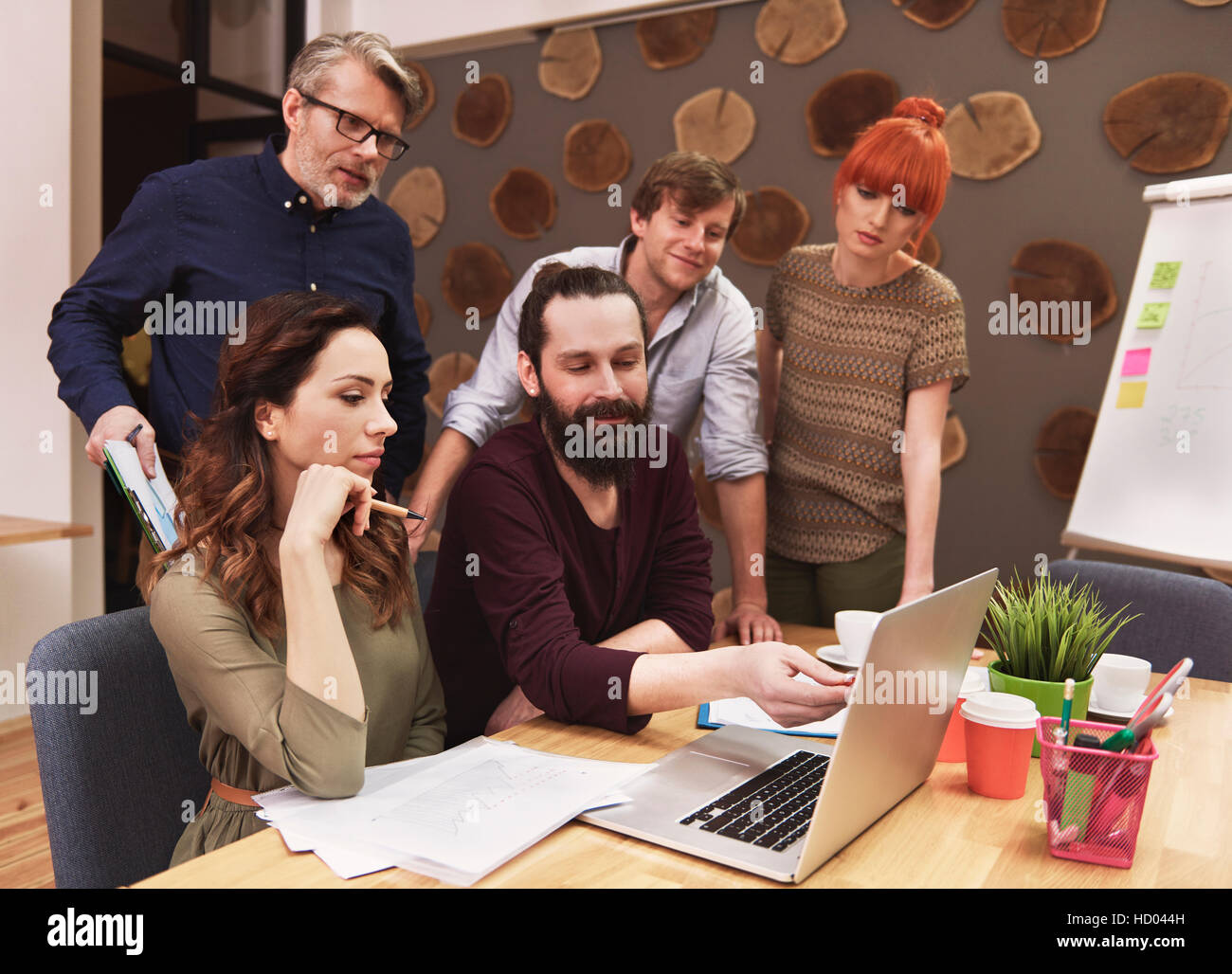 Business people laptop checking documents hi-res stock photography and ...