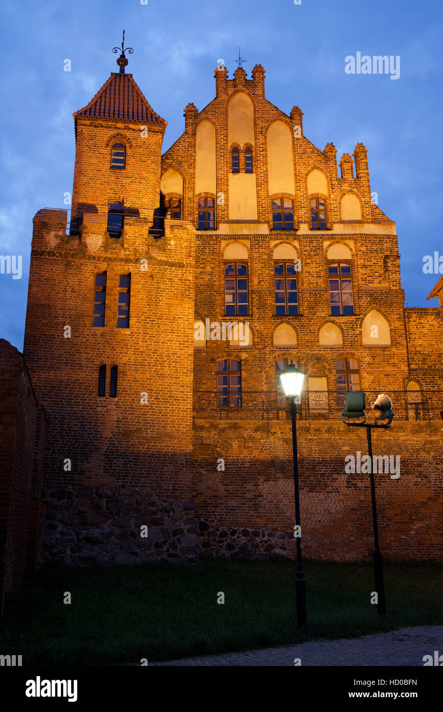 Citizen Court and sentry tower at night in Torun, Poland, former summer residence of the Brotherhood of St. George, medieval Gothic architecture, 13-1 Stock Photo