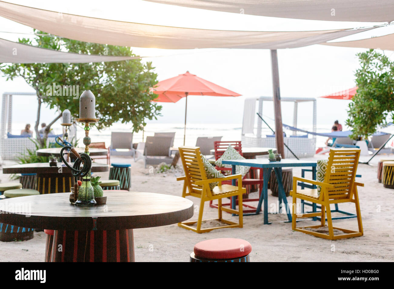 Colourful outdoor furniture at a beachside restaurant and bar on Gili Trawangan called Malibu. Stock Photo