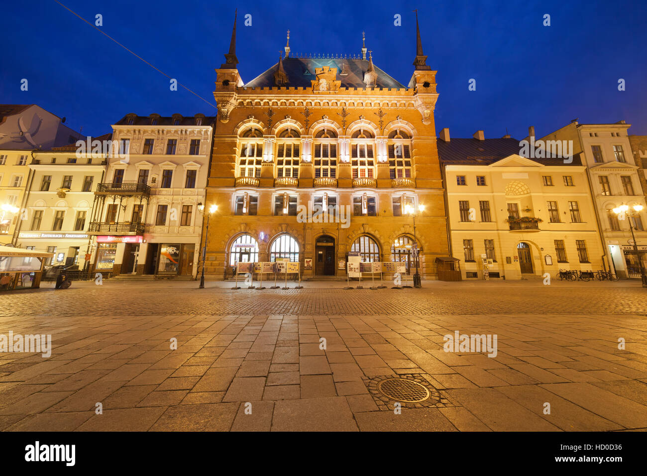 Artus Court by night at Old Town Market Square in Torun, Poland, city landmark Stock Photo