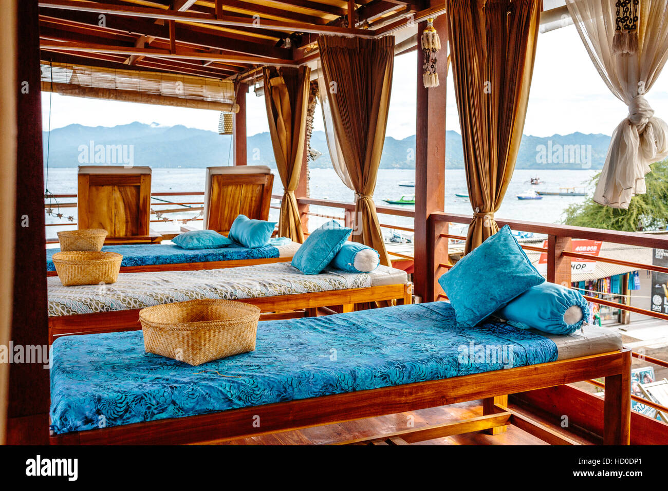Three massage tables and a scenic view of Lombok from Azure Spa in Gili