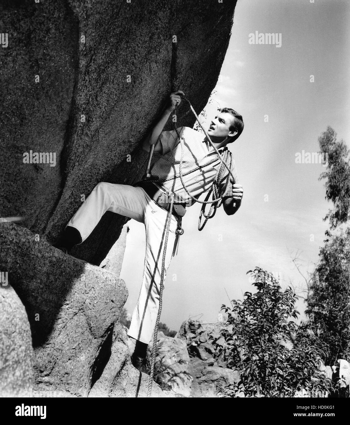 Adam West rock climbing, ca. 1961 Stock Photo Alamy