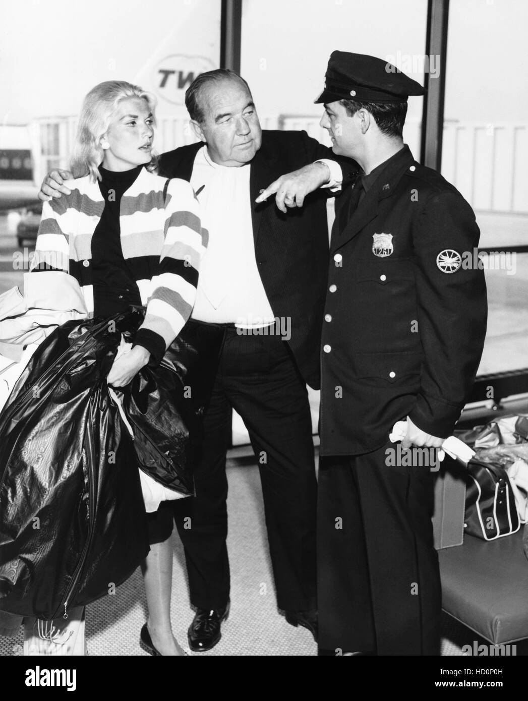 Honeymooners Broderick Crawford, center, and his second wife, actress