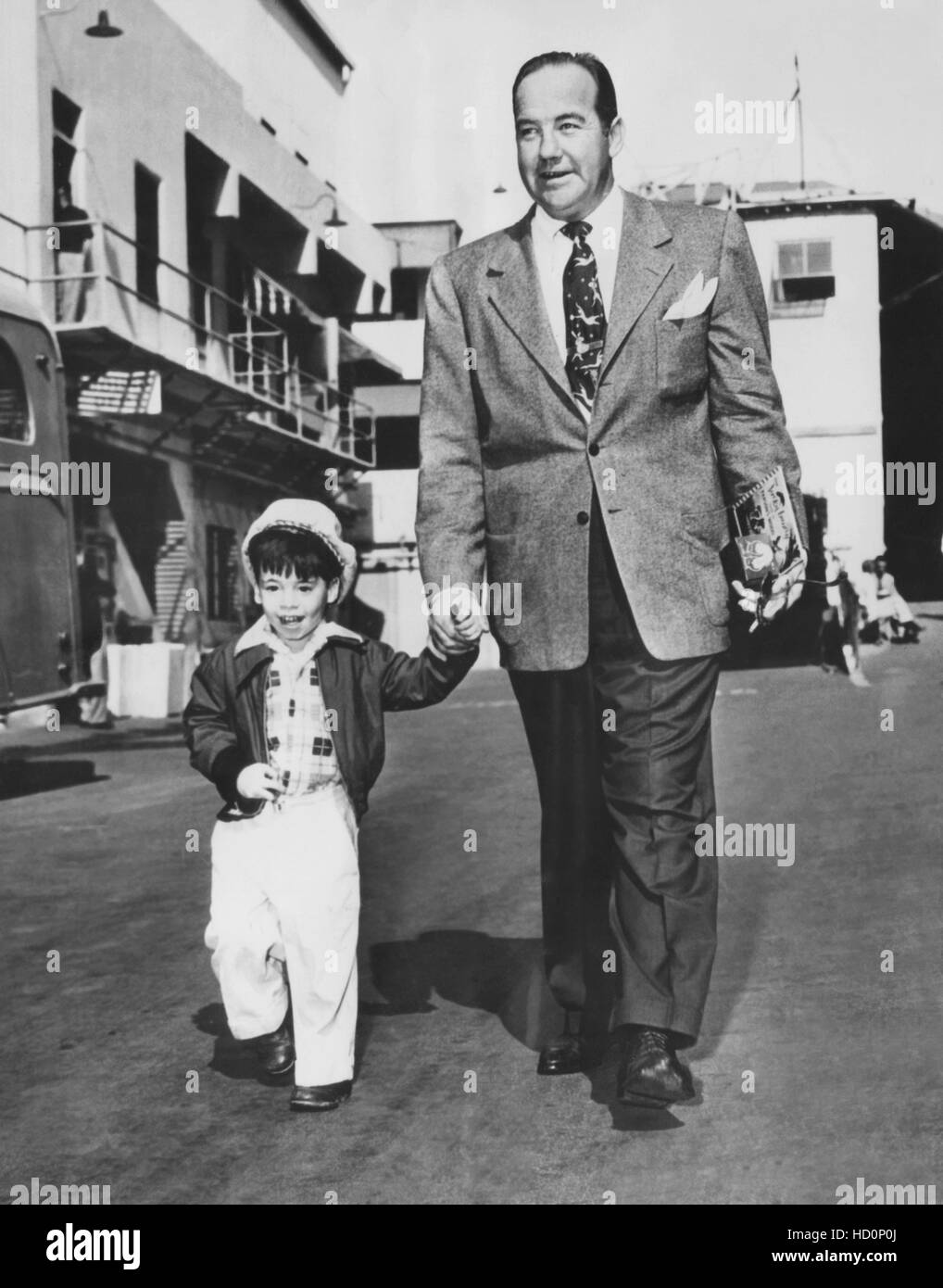 Broderick Crawford taking his son Kim Crawford on a tour of the