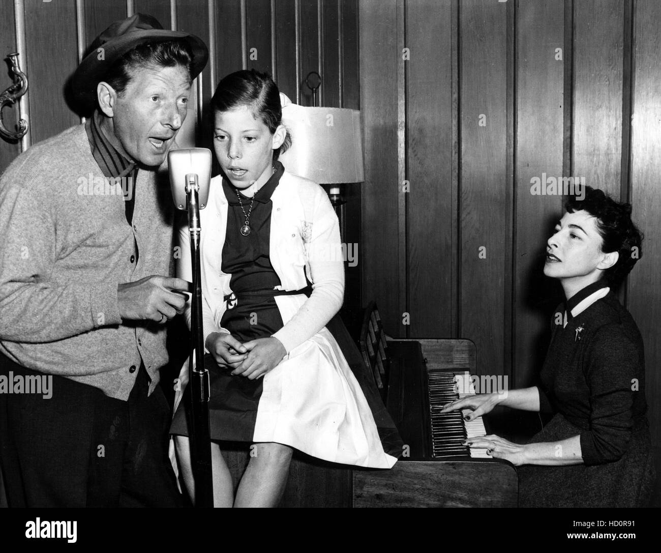 DANNY KAYE, daughter DENA KAYE and wife SYLVIA FINE run through a take of THE LITTLE CHILD, a record the trio is recording, Stock Photo