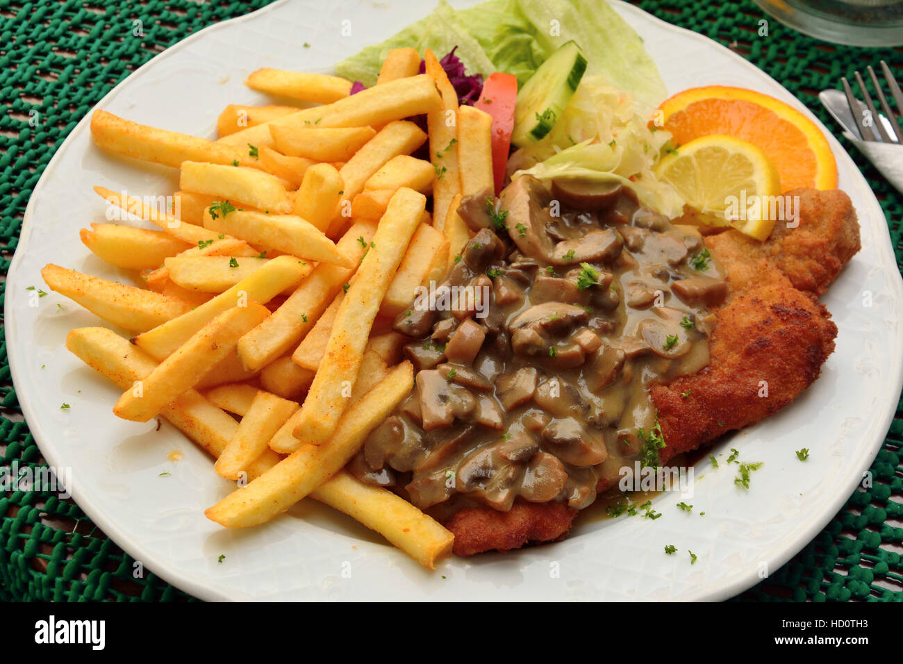 Schnitzel with mushroom sauce Stock Photo Alamy