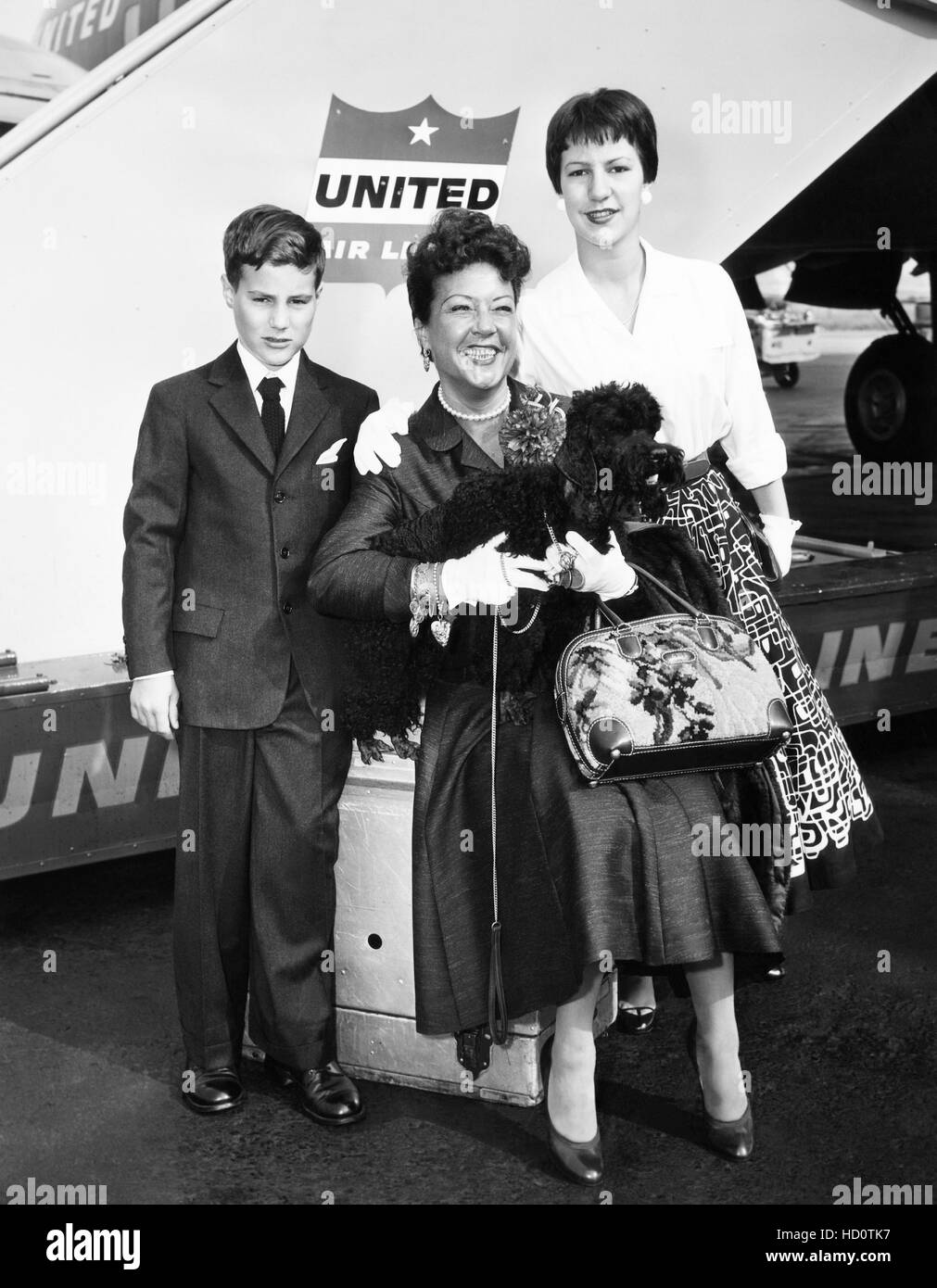 Ethel Merman, center, with her children, from left, Robert Levitt, and
