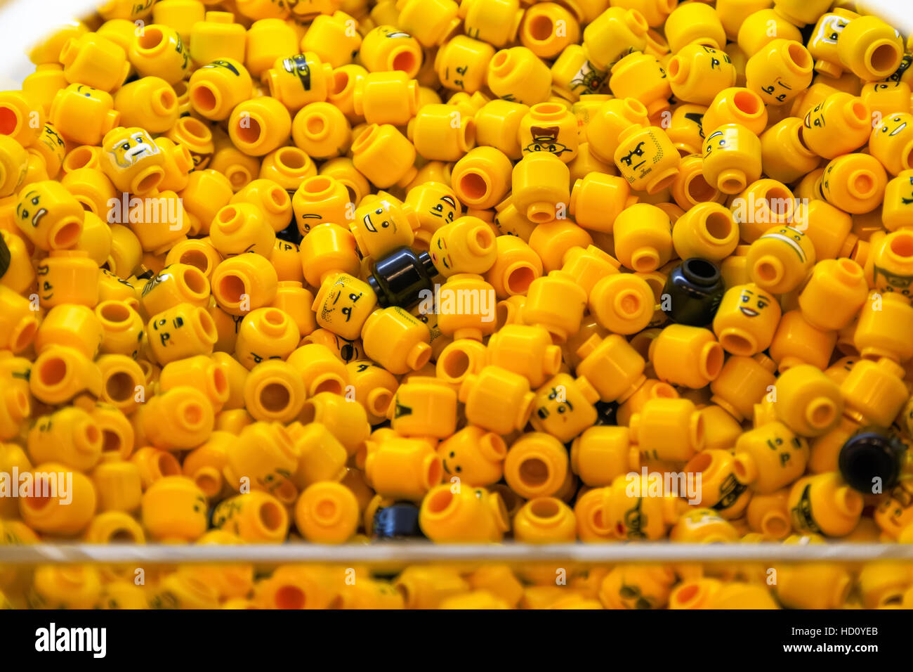 London, UK - November 22, 2016 - Pile of LEGO minifigure head parts Stock Photo