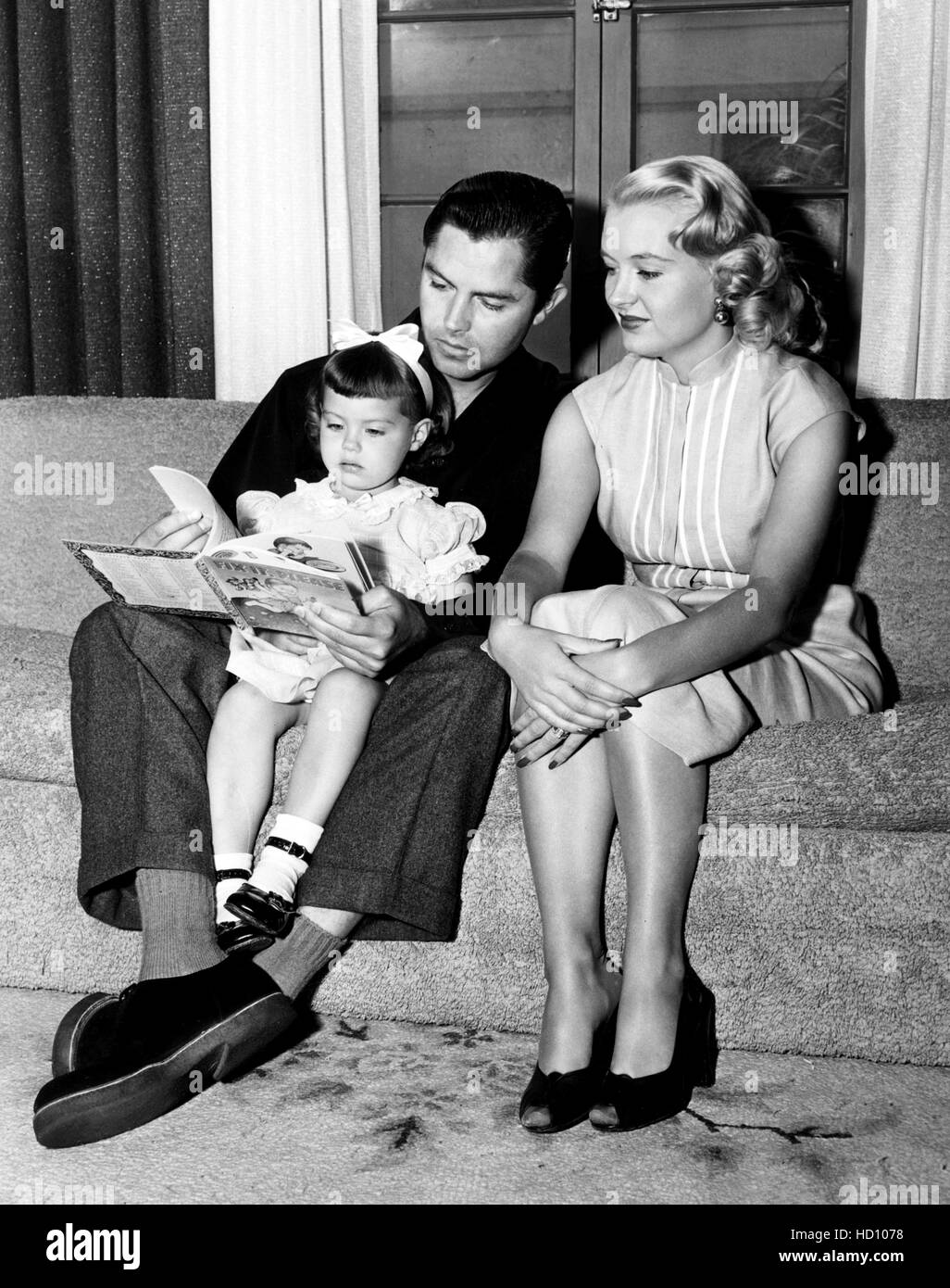 Jack Buetel, left, with his second wife, Gloria Buetel, and their daughter, Cynthia Buetel, 1952 Stock Photo