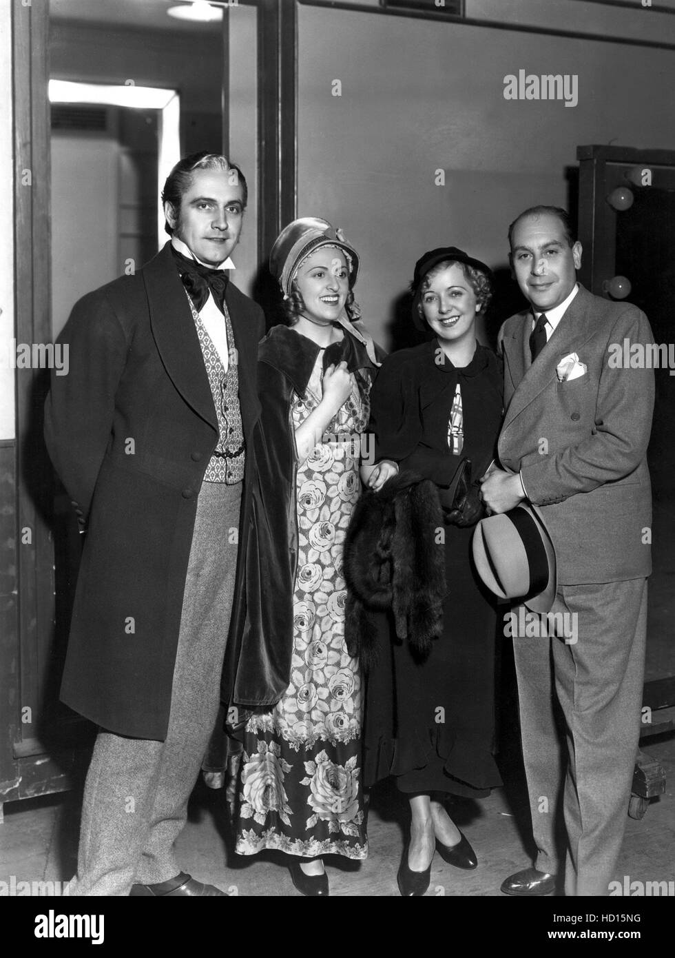 FREDRIC MARCH, wife FLORENCE ELDRIDGE, LADY HELENA PICKARD HARDWICKE, and husband SIR CEDRIC HARDWICKE on the set of LES Stock Photo