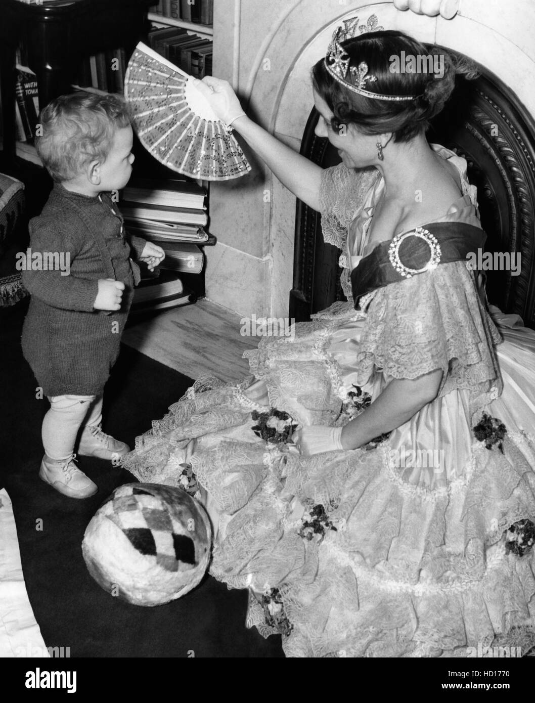 Helen Hayes with son, James, in costume for 'Victoria Regina', at home