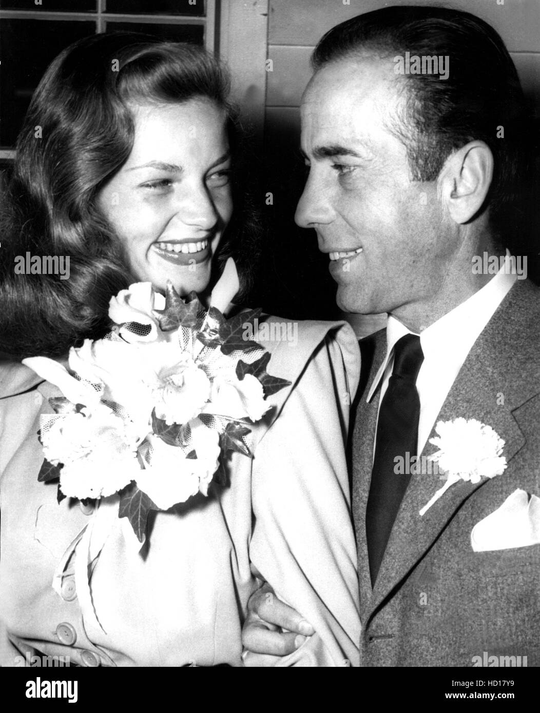 LAUREN BACALL giggles at husband HUMPHREY BOGART, newlywed, 1945 Stock ...