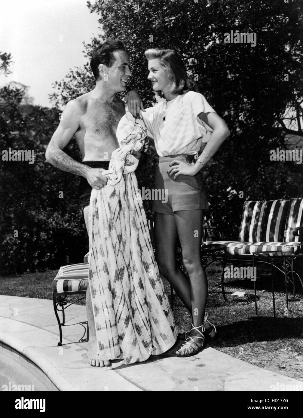 HUMPHREY BOGART and LAUREN BACALL poolside at home, 1940s Stock Photo ...