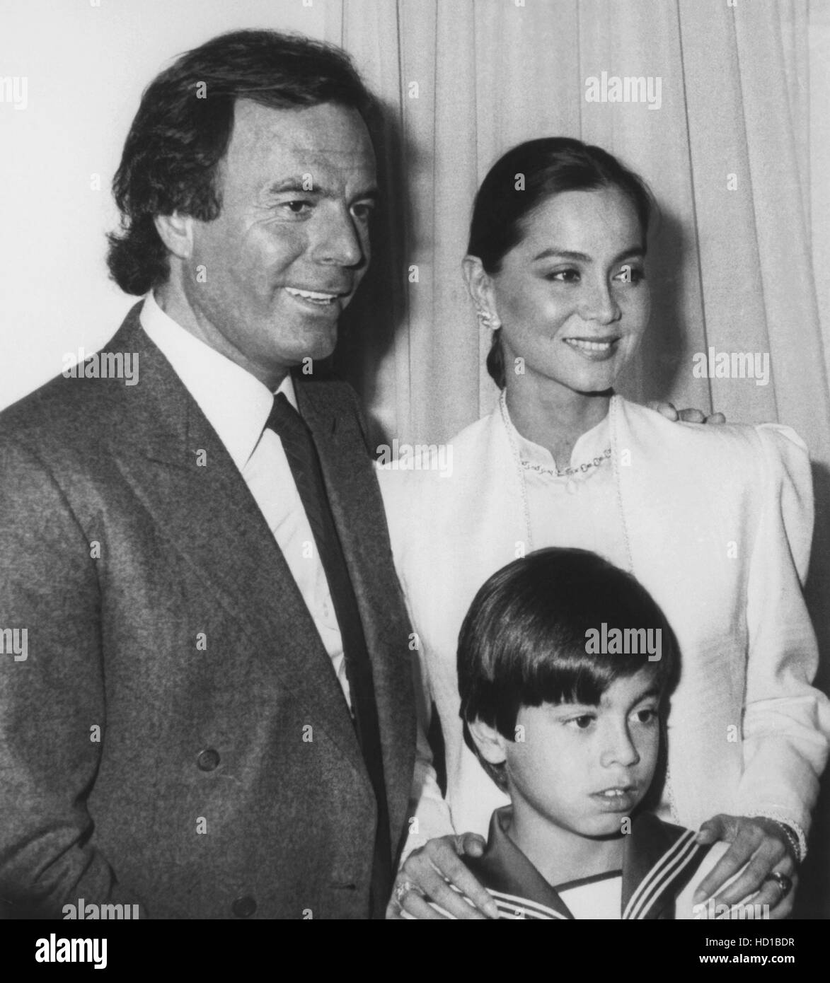 Julio Iglesias (left ) with ex-wife Isabel Preysler and son Enrique Inglesias at Enrique's first communion in Madrid, Spain, Stock Photo