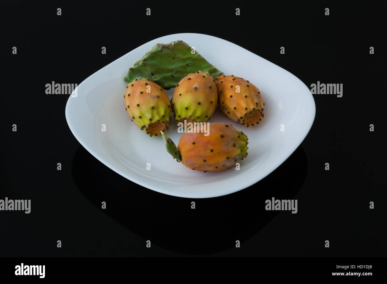 Prickly pear cactus fruits in a white plate Stock Photo