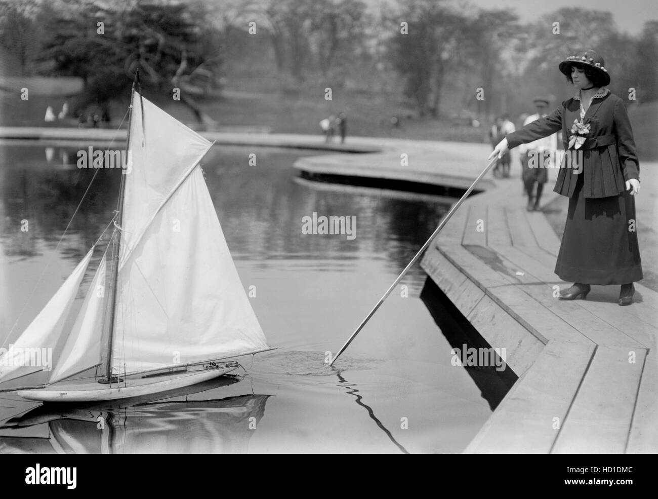 Woman with Model Yacht, Conservatory Lake, Central Park, New York City, New York, USA, Bain News Service, 1915 Stock Photo