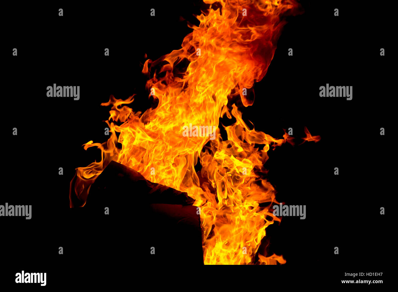 Photo of red fire flame on black background Stock Photo - Alamy