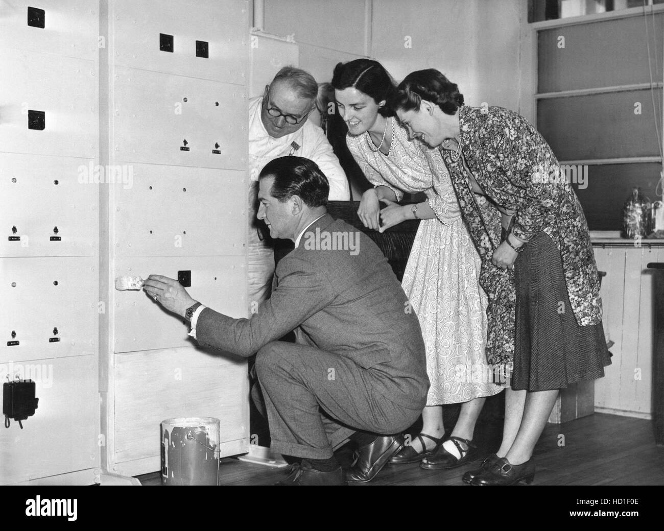 Singer Donald Peers (kneeling) at the Braemar knitwear factory in