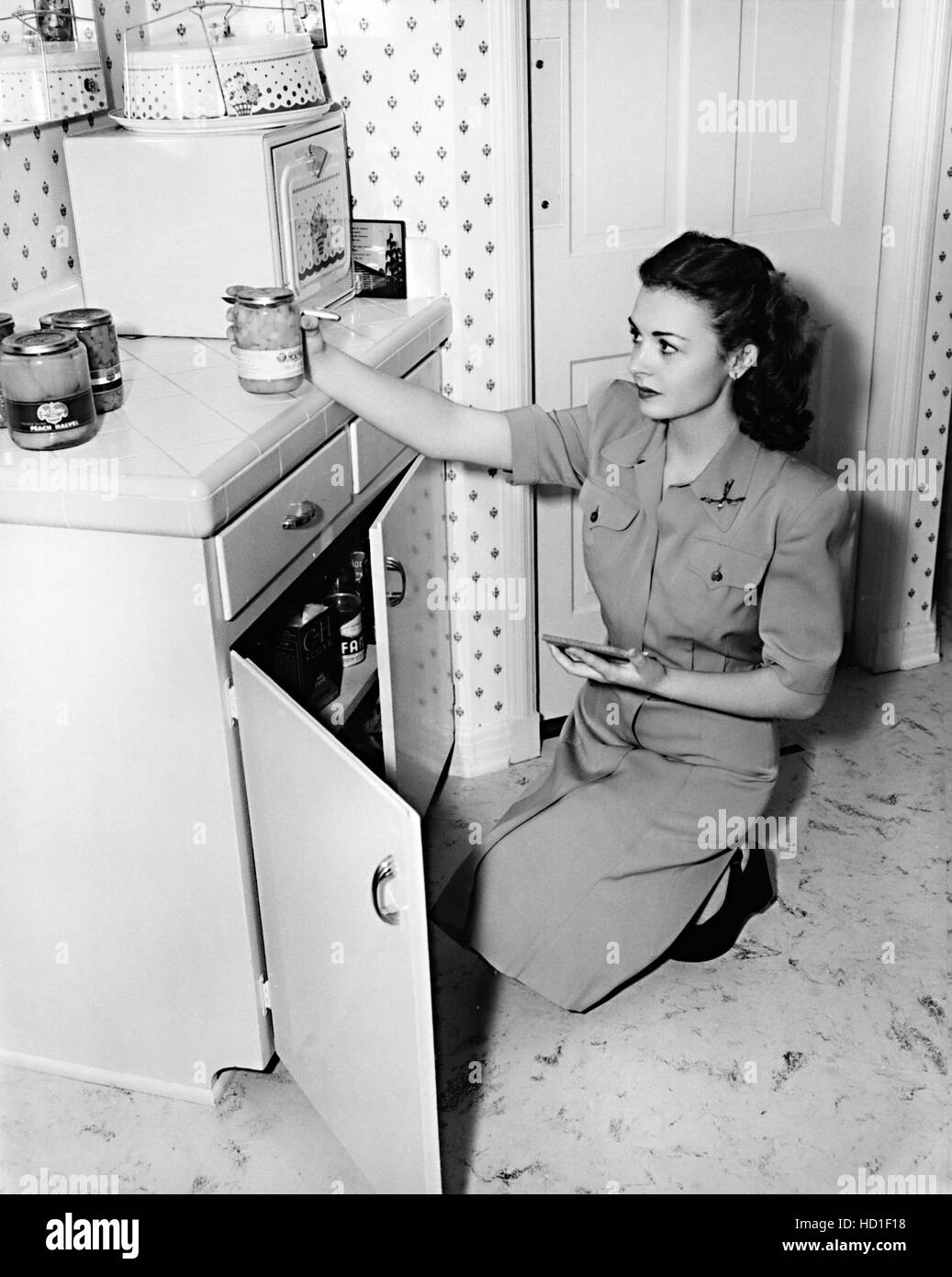 Donna Reed Kitchen DONNA REED, sorting out her cabinets, in her kitchen, shortly after ...