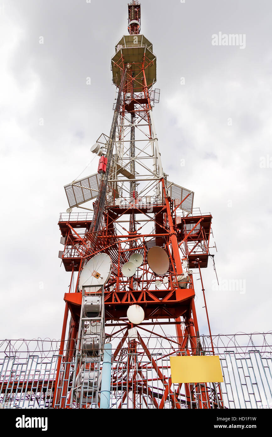 Vertical photo of cell tower and radio antenna Stock Photo
