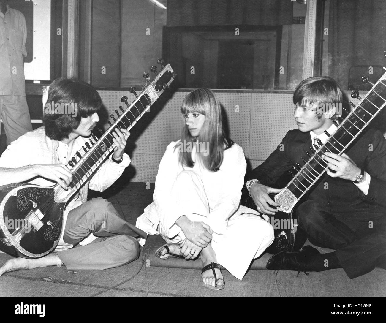 HARRISON, tutoring Michael York on the Sitar, with Rita