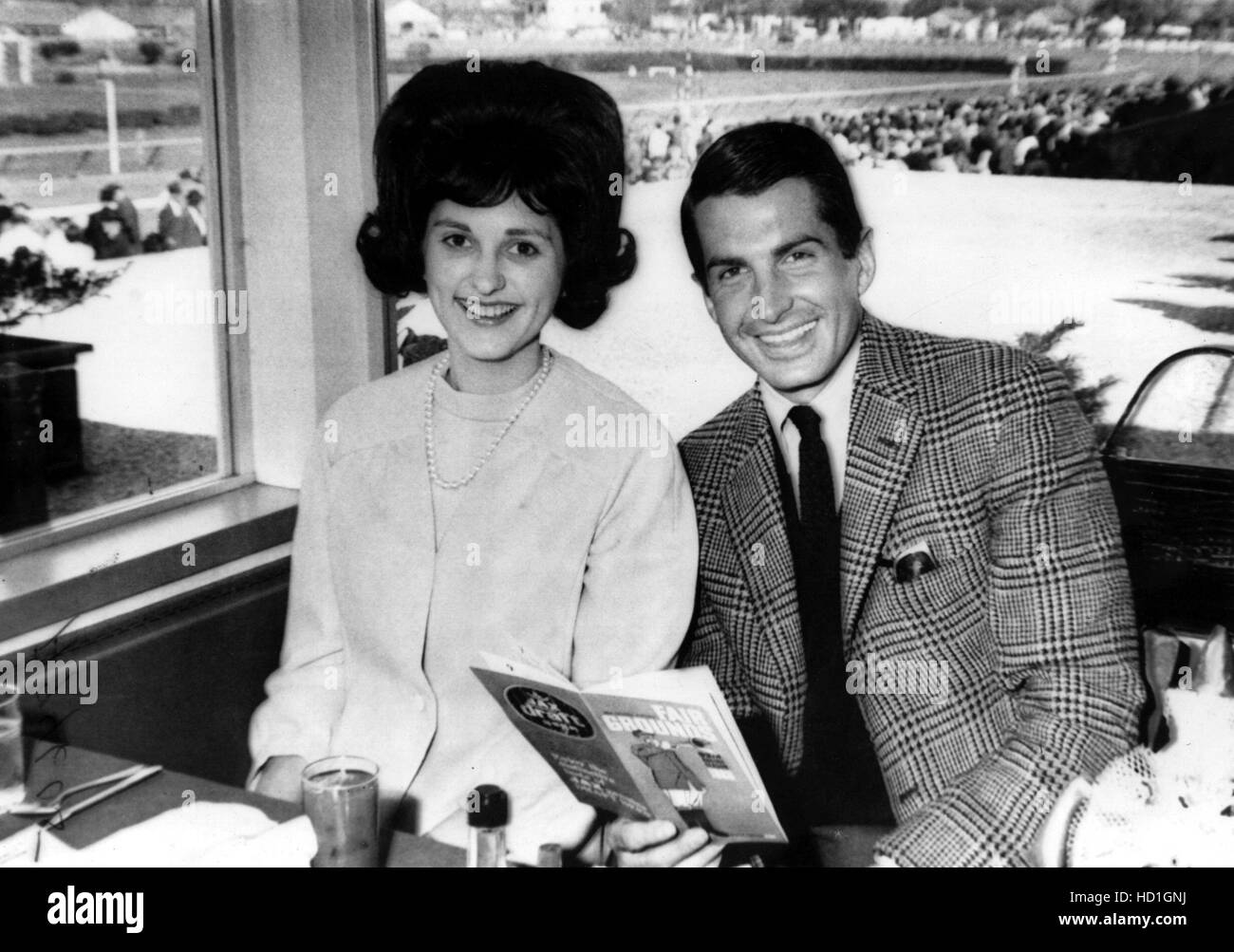 Lynda Bird Johnson and George Hamilton attend the horse races at the ...