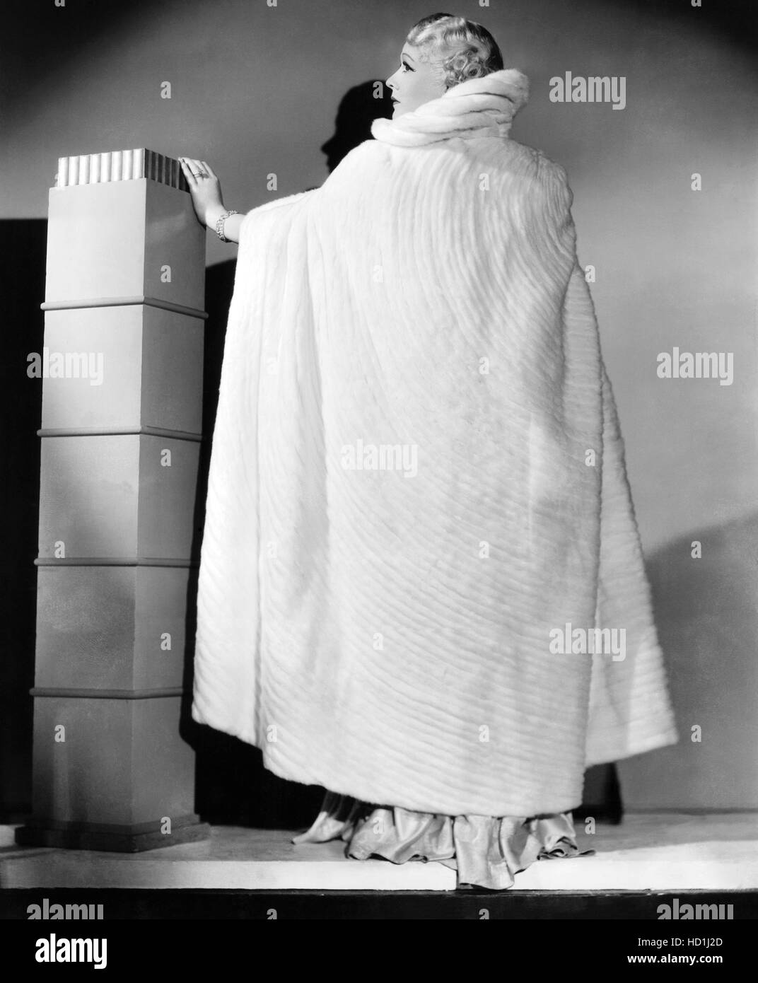 Gladys George wearing white ermine evening cape, ca. 1936 Stock Photo