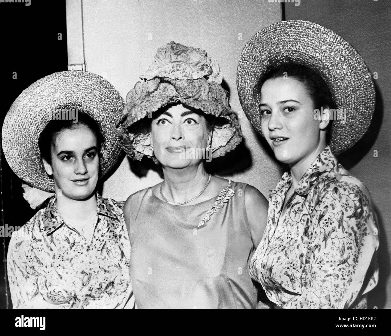 Joan Crawford, center, with her twin daughters, Cindy Crawford, and Cathy Crawford, April 1961