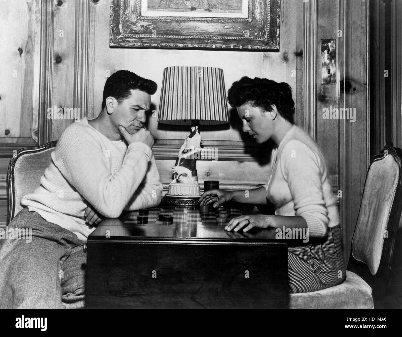 JOHN GARFIELD, with wife playing checkers, circa 1947 Stock Photo Alamy
